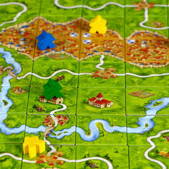 Overzicht van het Carcassonne bordspel met tegellegspel en uitbreidingen in middeleeuws thema