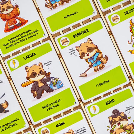 Afbeelding van het bordspel Tanuki, te koop bij Speldorado. Het spel heeft een Japans thema met schattige tanuki-figuren en kleurrijke kaarten