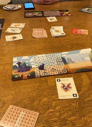 Dit is een foto van het spel Happy Little Dinosaurs NL te koop bij Speldorado Spellenwinkel Delft